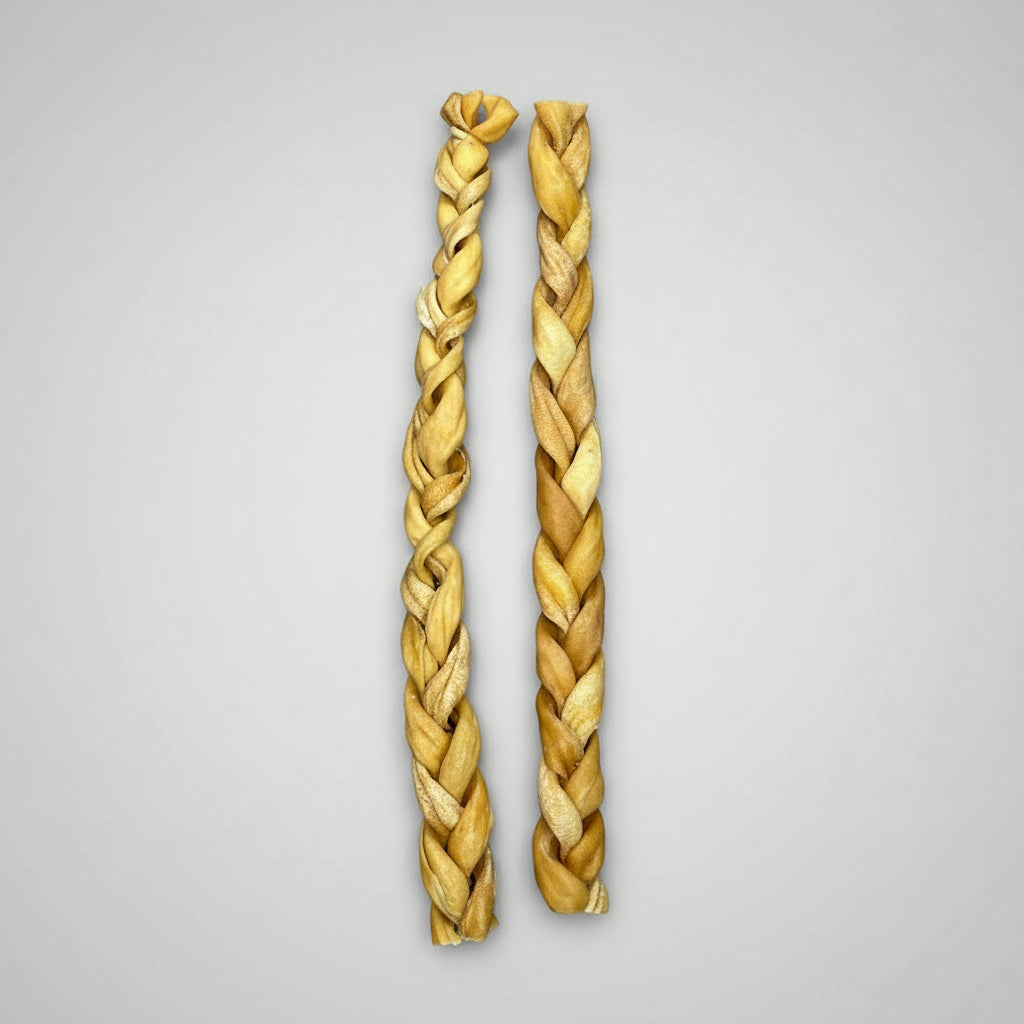 Two braided lambs on a grey background, likely used for pet treat supplies.