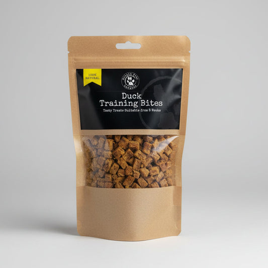 Package of duck training bites with a blurred indoor background